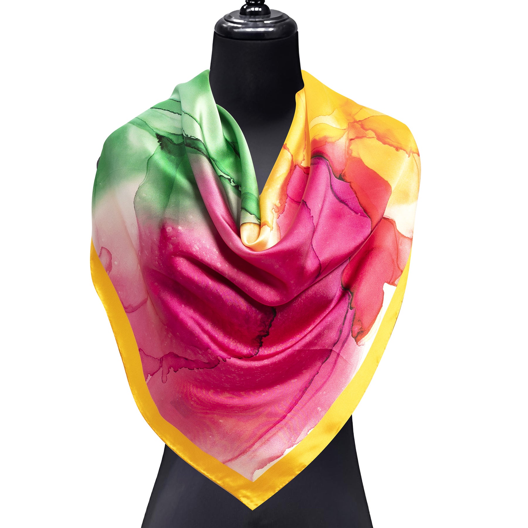 The Hamzah Yellow and Purple Silk Scarf features a fluid art print with watercolor-inspired abstract patterns and a yellow border, elegantly draped over a black mannequin bust.