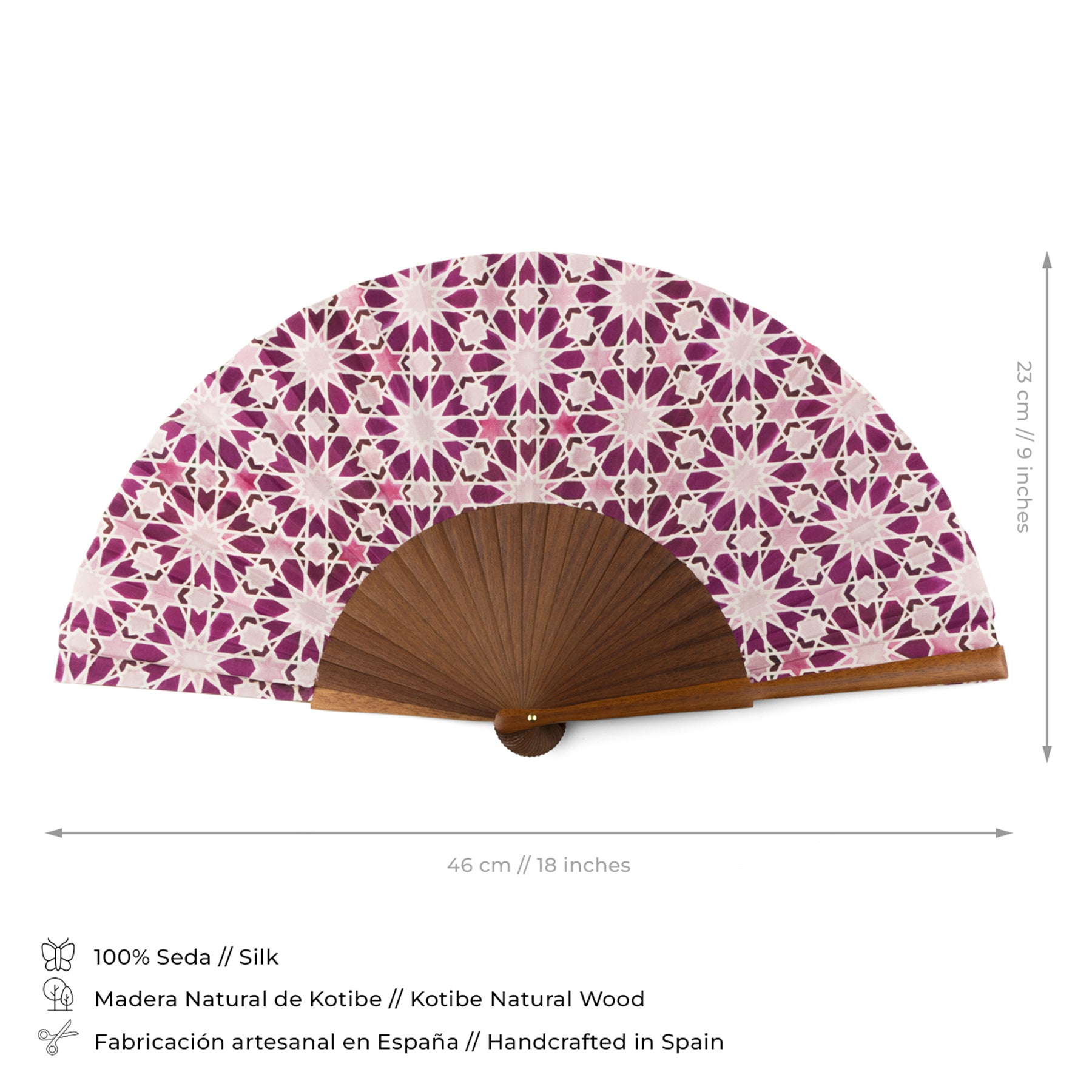 The Pink Silk hand fan Zellige is a handcrafted Spanish fan made of natural wood and silk, featuring a purple and white geometric floral pattern inspired by Islamic geometry. It measures 43.5 cm wide and 23 cm tall.