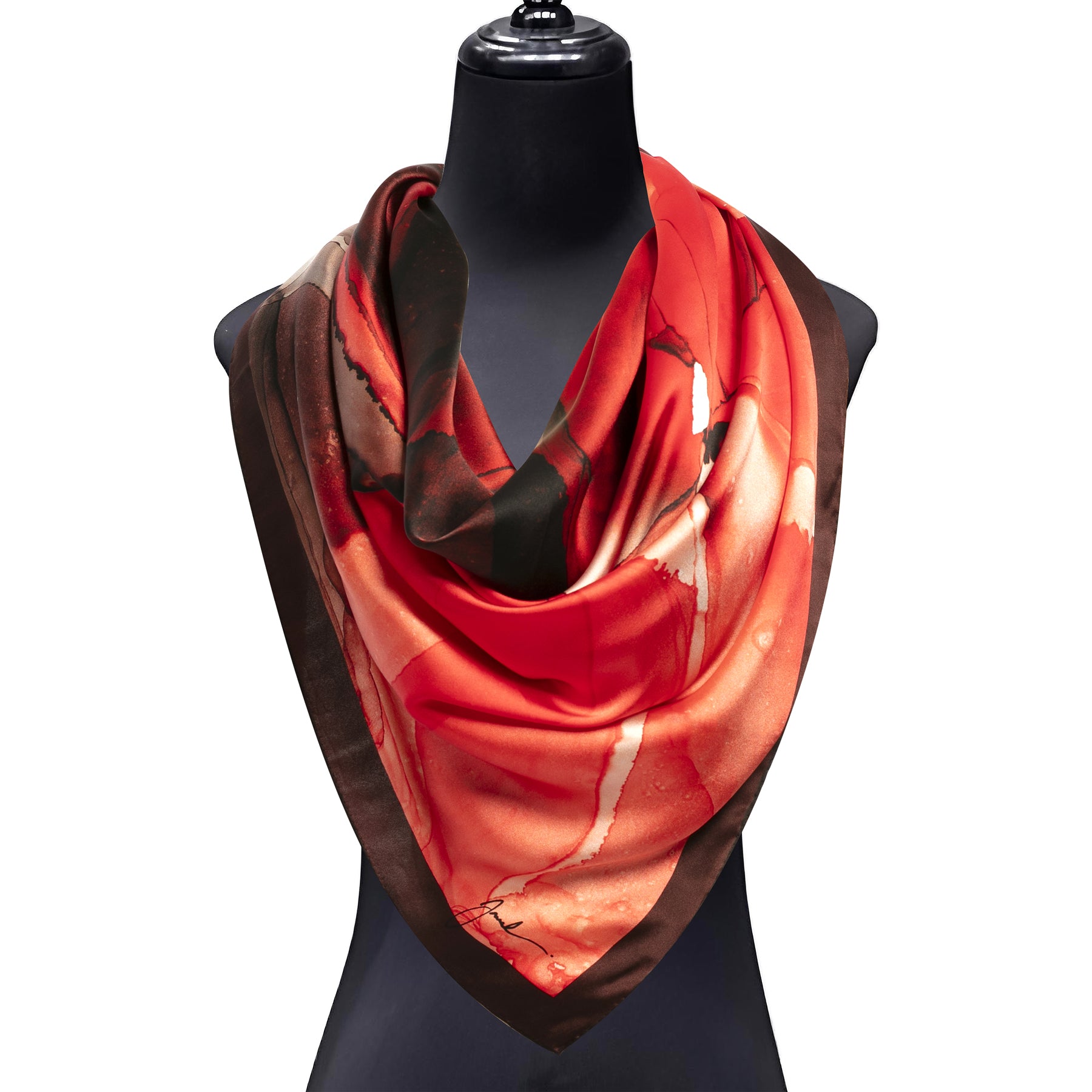 A mannequin showcases the Hamzah Red Silk Scarf Square Fluid Art, crafted in satin silk with bold red, orange, and brown abstract patterns, draped stylishly around the neck.