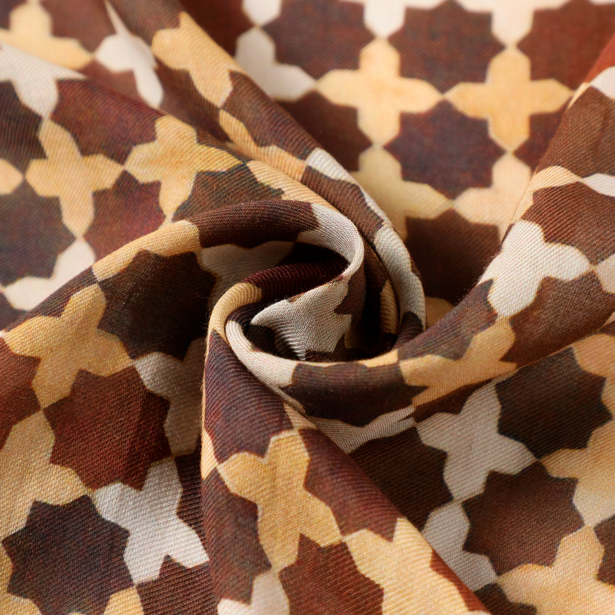 A close-up of the Brown Islamic Art-Inspired Modal Scarf Andalus, twisted at the center to reveal its geometric patterns in brown, beige, and cream tones, with textured folds reminiscent of Islamic art.