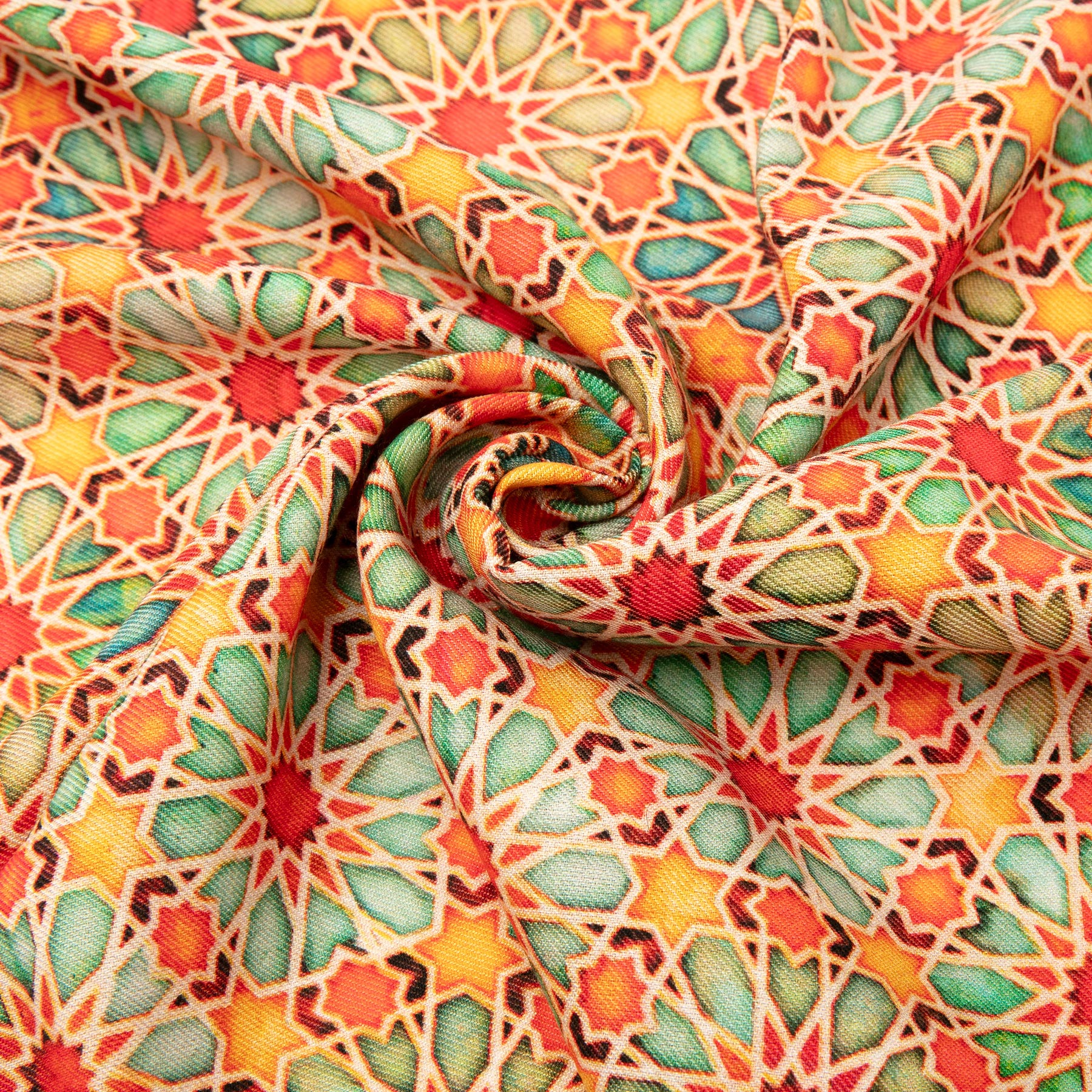 Close-up of the Wool & Silk Islamic Art Inspired Orange Scarf, displaying an intricate geometric star pattern in red, yellow, orange, and green swirls, inspired by traditional Islamic motifs for a vibrant look.