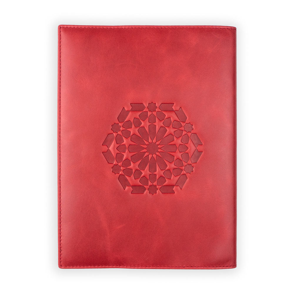 Munira Leathers Leather Notebook Cover Zellige Red is a handmade A5 red cover featuring an embossed geometric floral design, crafted by artisans and showcased against a plain white background.