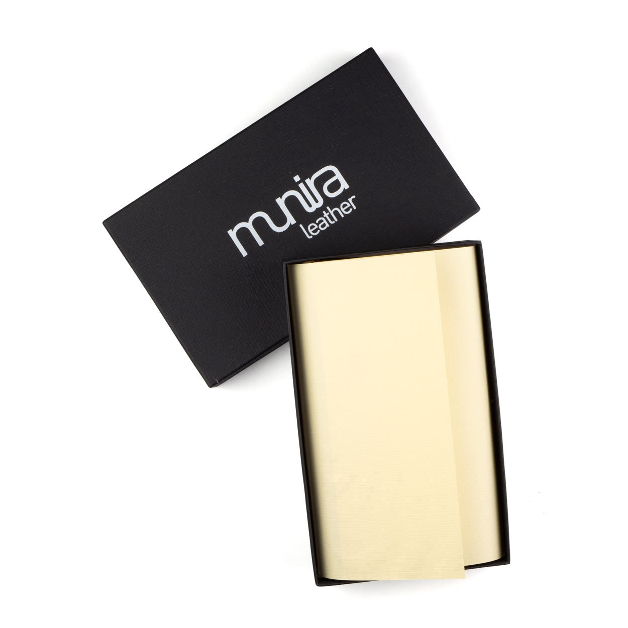 A yellow Flower of Life Embossed Large Leather Wallet by Munira Leather, handmade in Spain, rests open on a white background, its box and slightly tilted lid featuring the brand name alongside.