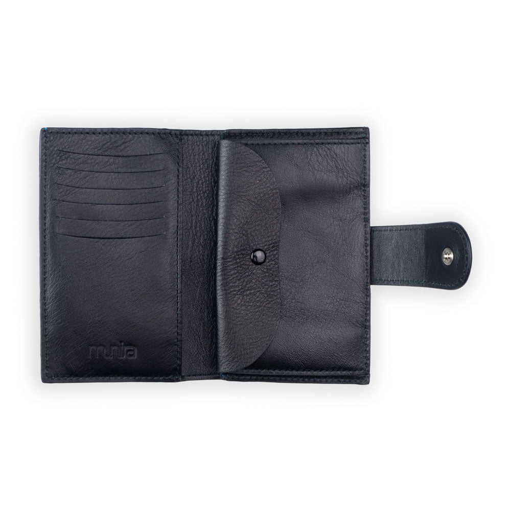 Open brown handmade leather Zellige wallet with card slots on the left, a central pocket, and a snap button flap