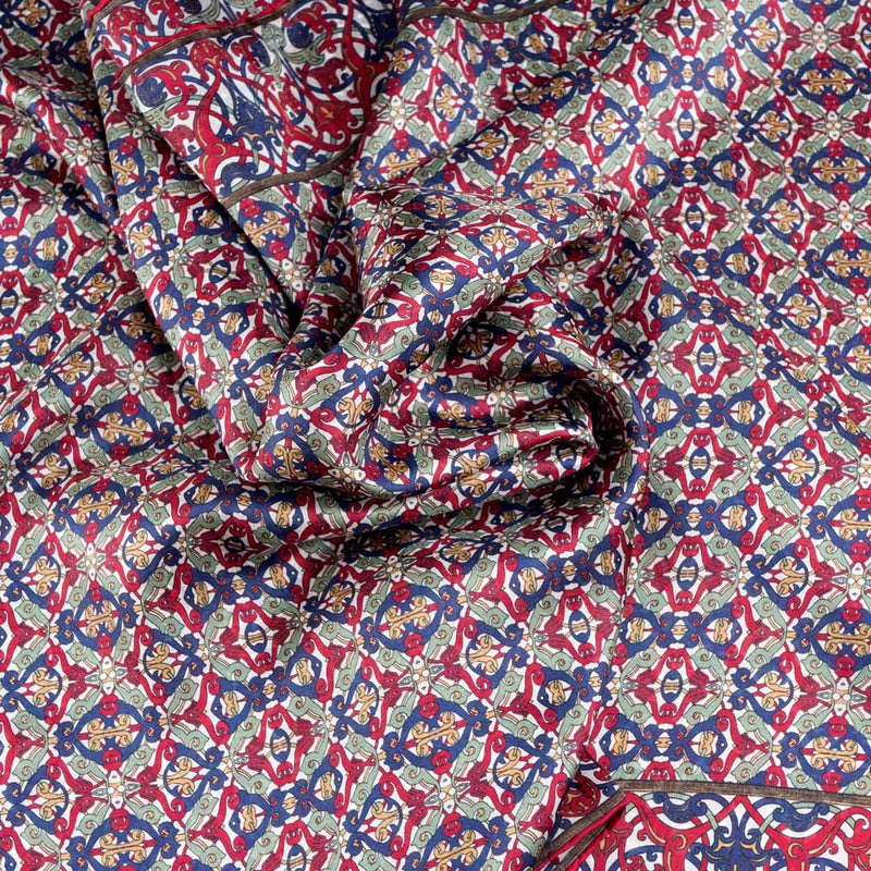 Detail of burgundy and blue silk scarf inspired by geometric eastern tiles