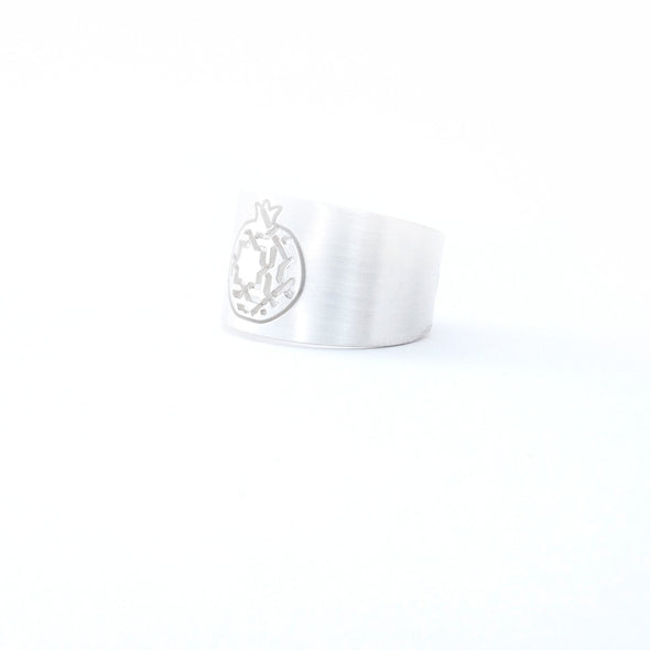 The Platónica Sterling Silver Wide Ring Granada No.3 is a sleek, handcrafted 925 sterling silver ring featuring an engraved dragon emblem on a wide band, set against a plain white background.