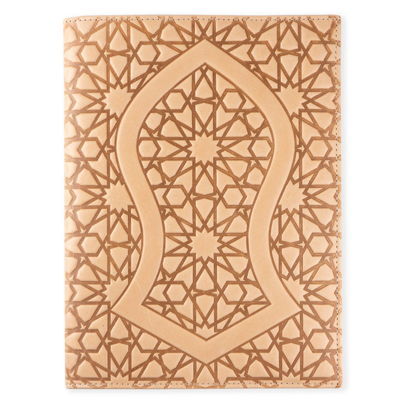 The Munira Leather Na´layn Leather Journal Cover Natural features tan full grain leather with an intricate geometric and star motif and a central arch inspired by Islamic art, offering stylish, refillable protection for your notebook.
