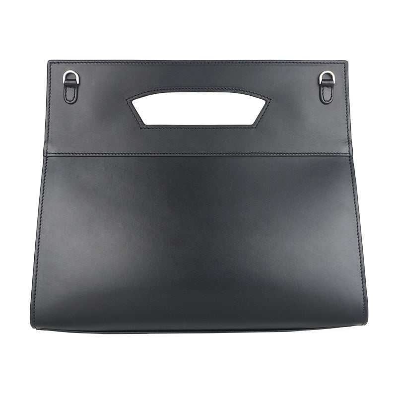 The Munira Leather Leather Bag Lisboa Sultaniyya is a sleek, black handbag crafted from full-grain cowhide with a minimalist design. It features a rectangular shape, integrated handles, stitched edges, silver hardware loops, and a detachable strap for versatility.