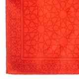 Detail of red square scarf with islamic art pattern