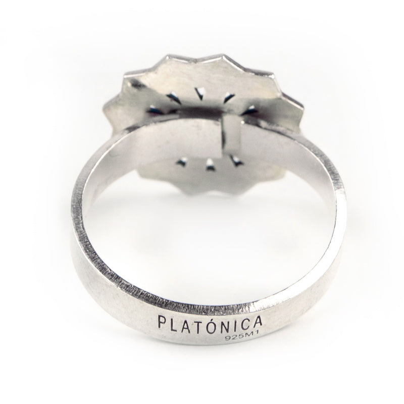 The Silver Ring Estrella by Platónica features a scalloped design with intricate geometric patterns. It is marked with Platónica and 925 M1 inside the band, and is handmade in Granada, displayed against a plain white background.