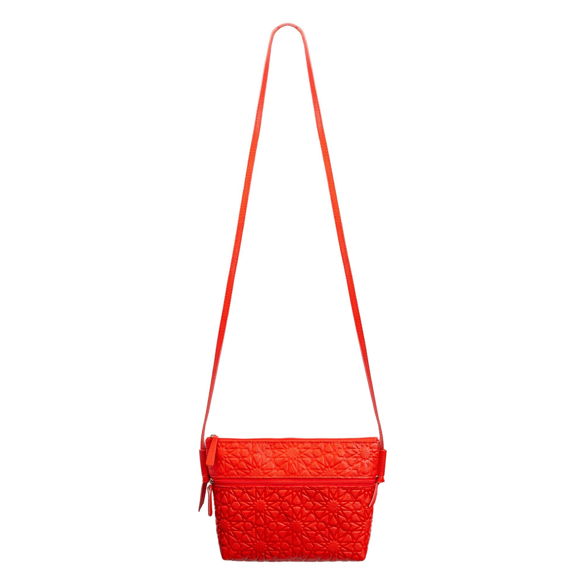 The Red Embossed Crossbody Bag with Islamic Design Pattern features a geometric motif, long slim strap, and zipper closure, shown against a plain white background.