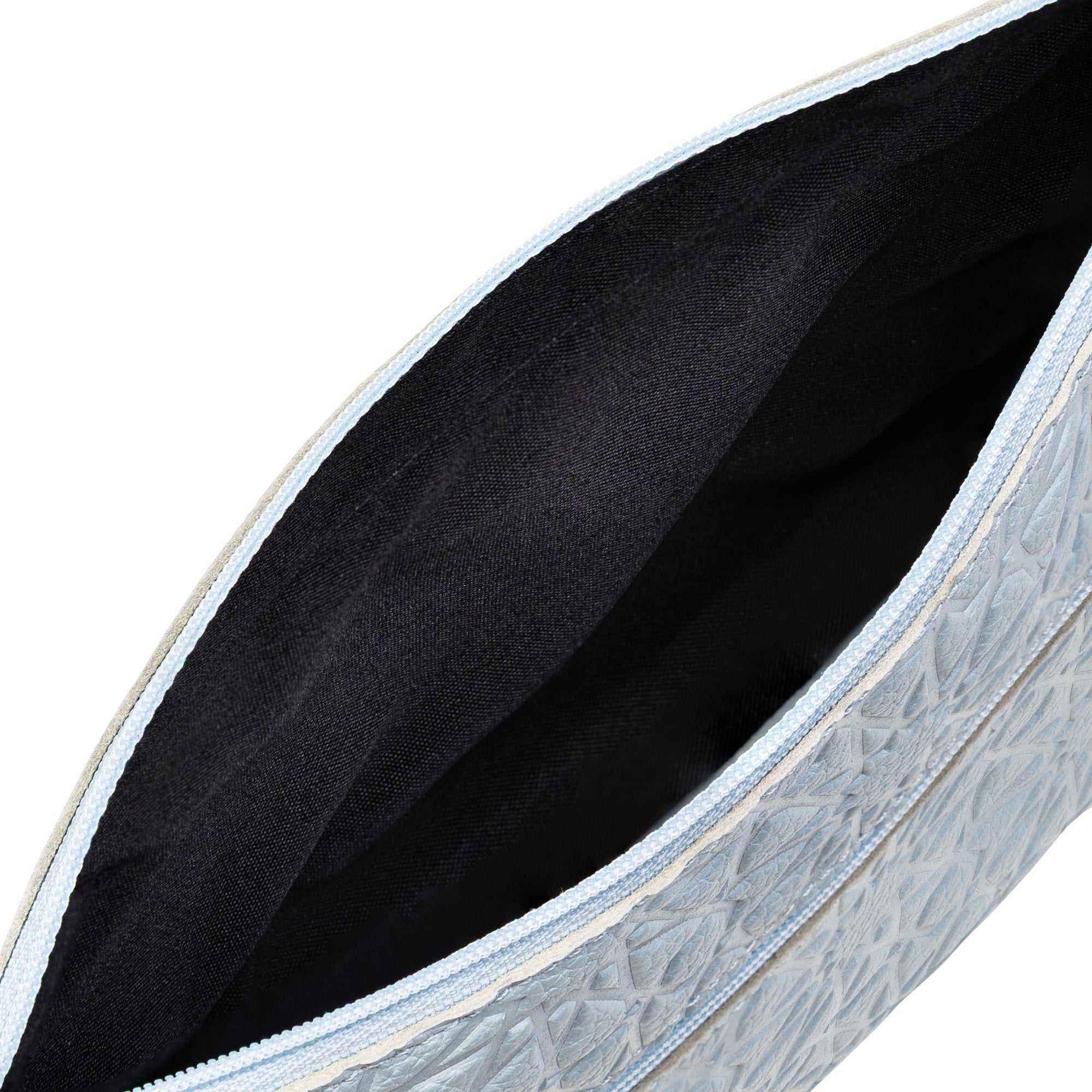 Open view of the Light Blue Embossed Crossbody Bag with Islamic design pattern, crafted from genuine cowhide leather and featuring a black fabric interior lining.