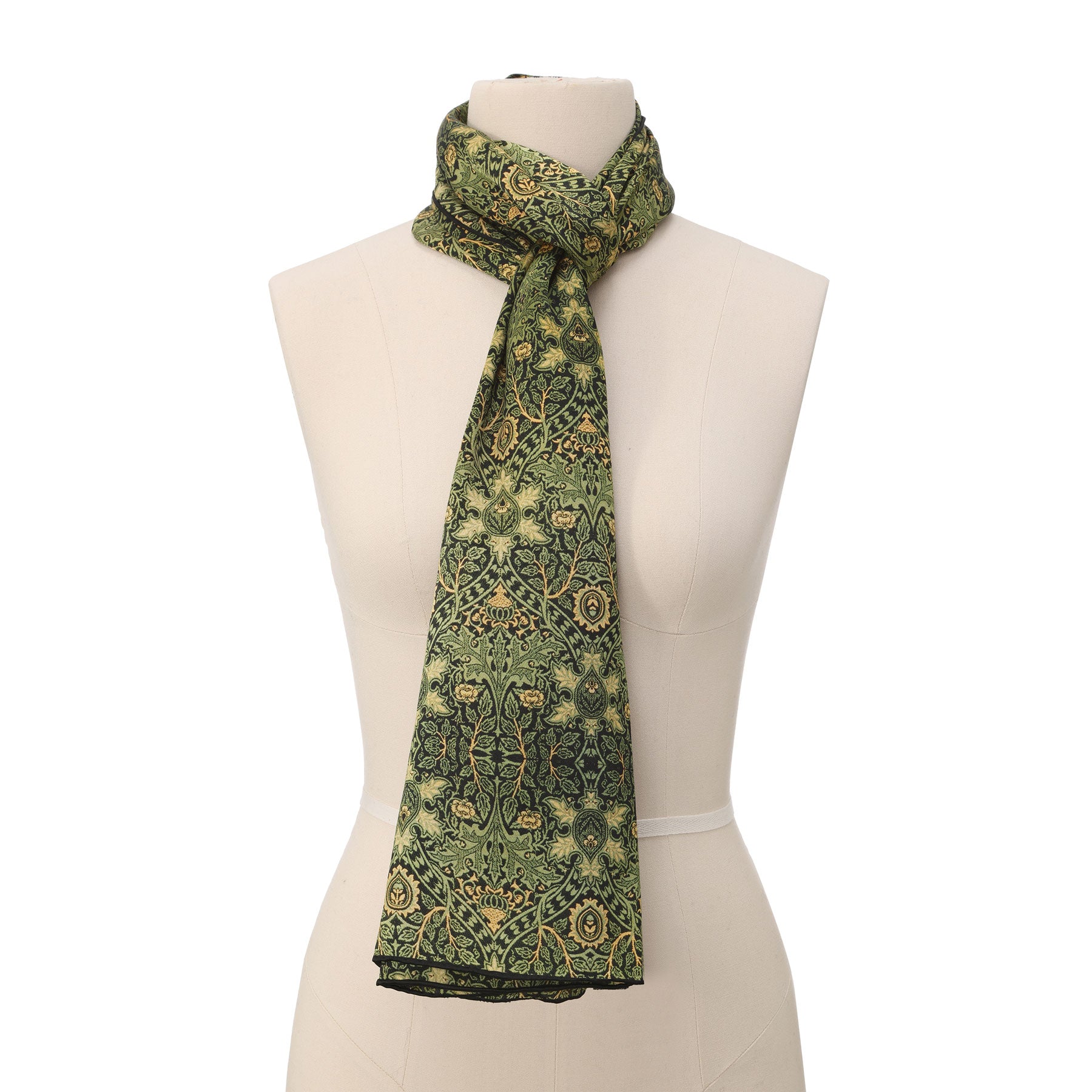 Inspired by heritage, this rectangular mat has a green backdrop with detailed yellow and gold geometric floral patterns, echoing the style of the Vintage Green Silk Scarf with Ornate Gold Motifs.