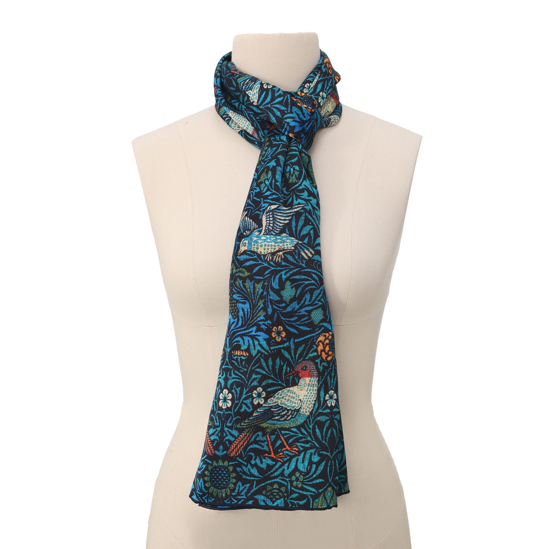 The William Morris Inspired Silk Scarf features intricate bird and floral motifs in blue, green, yellow, and orange