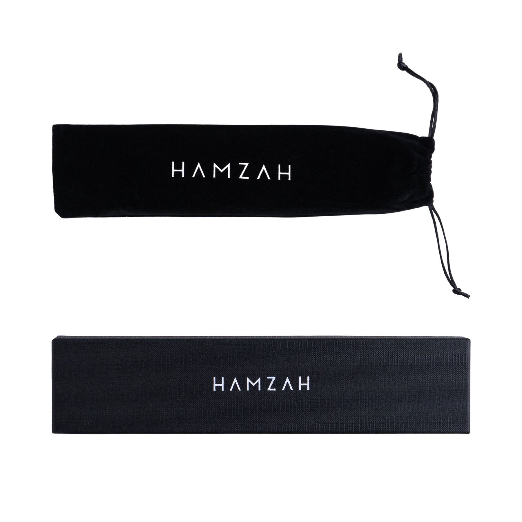 Two black cases with "HAMZAH" in white—one a soft drawstring pouch, the other a rectangular box—perfect for storing or gifting the Folding Silk Fan with Floral Print Elinor that showcases exquisite Spanish craftsmanship.