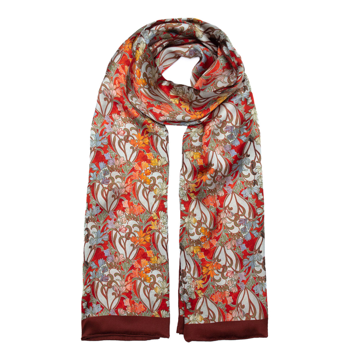 Long art deco silk scarf draped to display its bold red, orange, and pastel floral patterns, finished with a rich border.