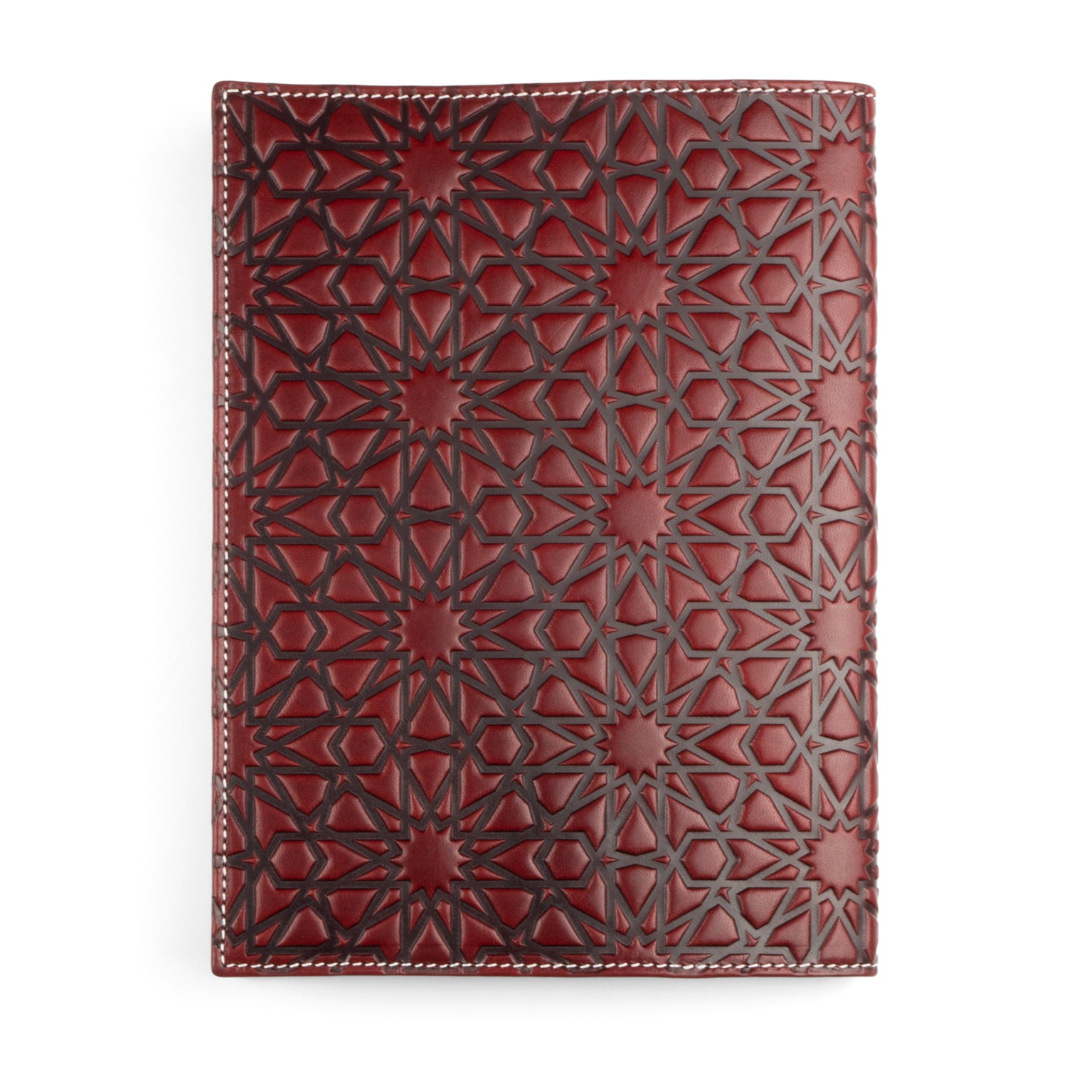 A deep burgundy leather notebook cover embossed with intricate Islamic geometric patterns, featuring repeating star and polygon motifs. The rich leather is finished with clean white stitching, creating a refined contrast.