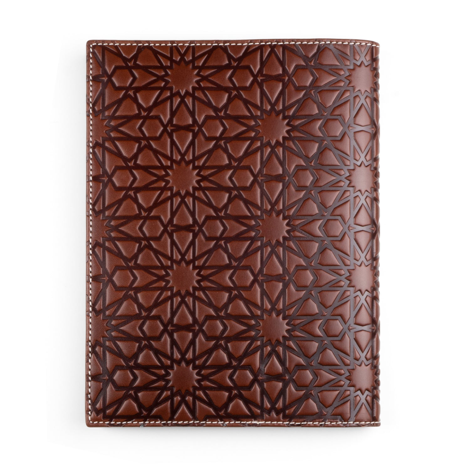 A dark brown leather notebook cover embossed with an intricate Islamic geometric pattern. The design features repeating stars and polygons, giving the cover a rich texture. The high-quality leather is bordered with neat white stitching.