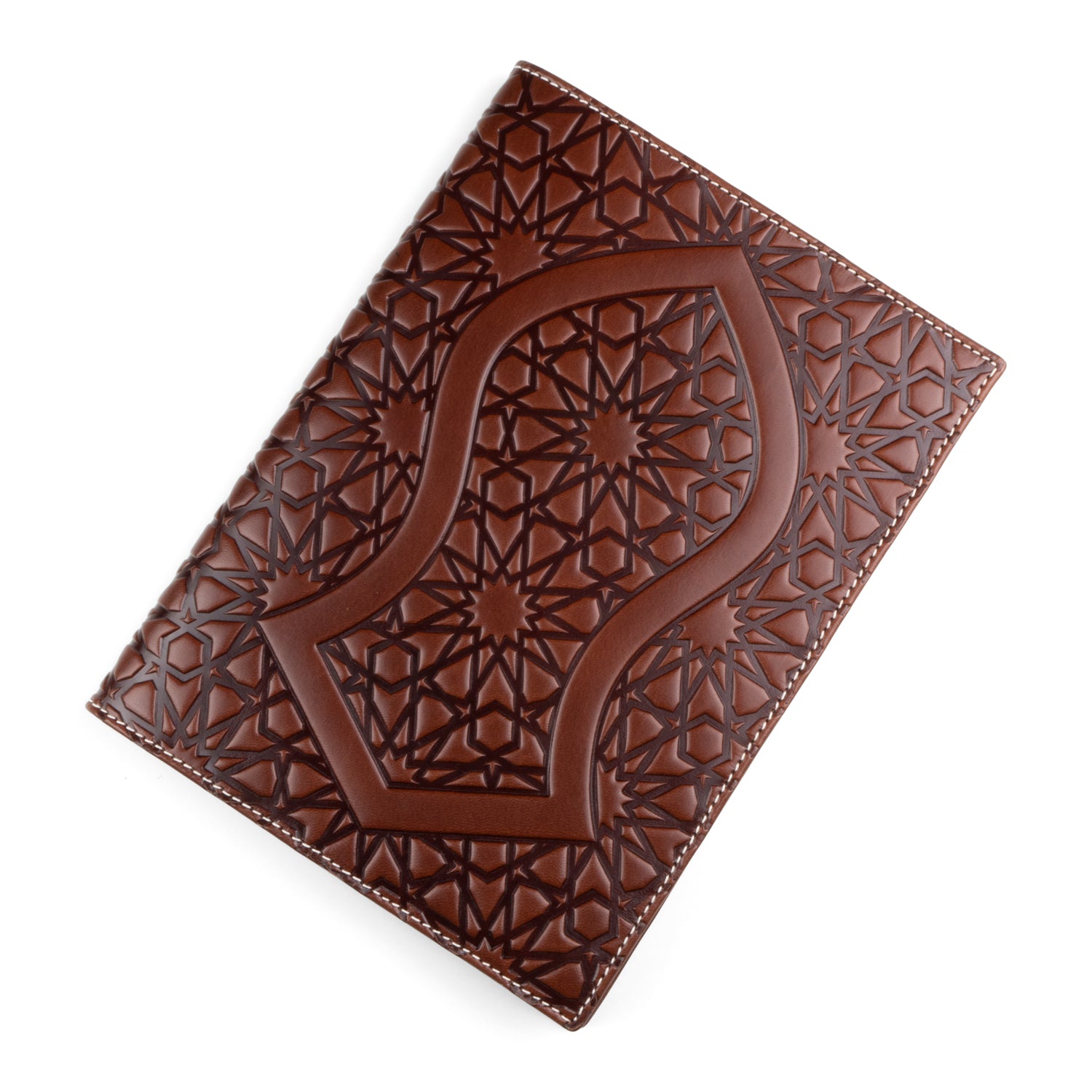 A dark brown leather notebook cover featuring a prominent embossed Nalayn-inspired design, symbolizing the sandal of the Prophet Muhammad (SAW), surrounded by detailed Islamic geometric patterns. The cover is finished with white stitching along the edges.