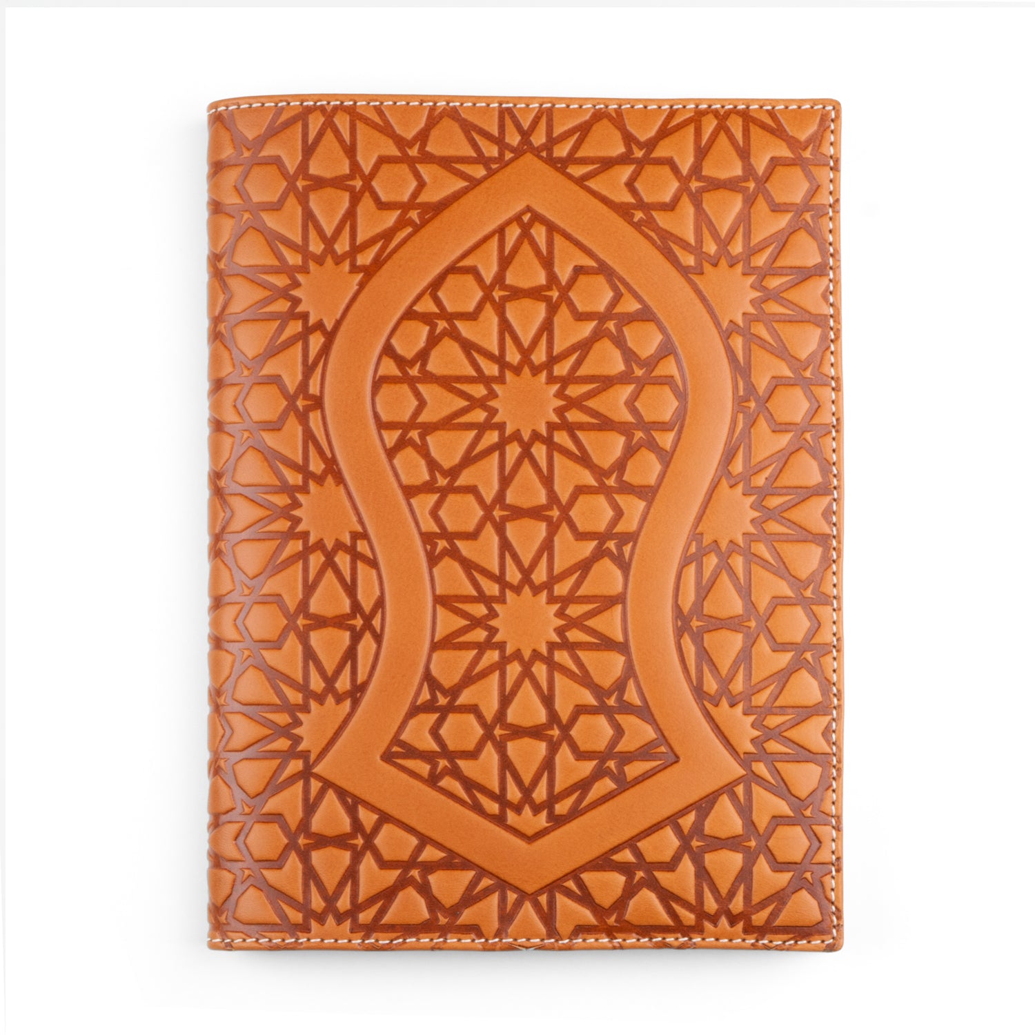 A tan leather notebook cover displaying a central Nalayn design, framed by a pattern of stars and polygons inspired by Islamic geometry. The embossing adds texture, while the white stitching provides a neat border.