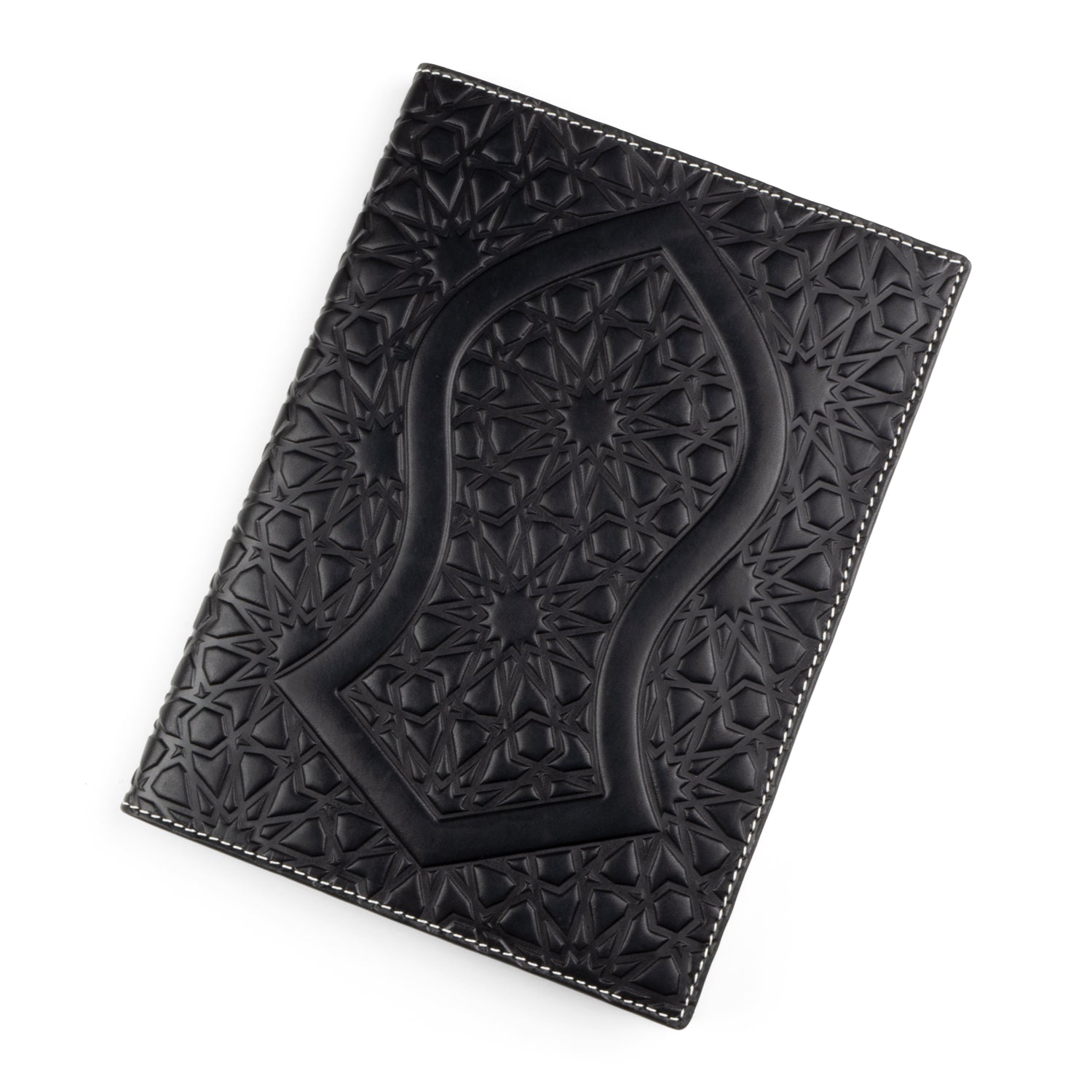 A black leather cover embossed with an Islamic geometric pattern, featuring a prominent, large arch-shaped motif at the center. This pattern is made of repeating stars and polygons, adding depth and texture to the cowhide leather. The edges are finished with fine white stitching.