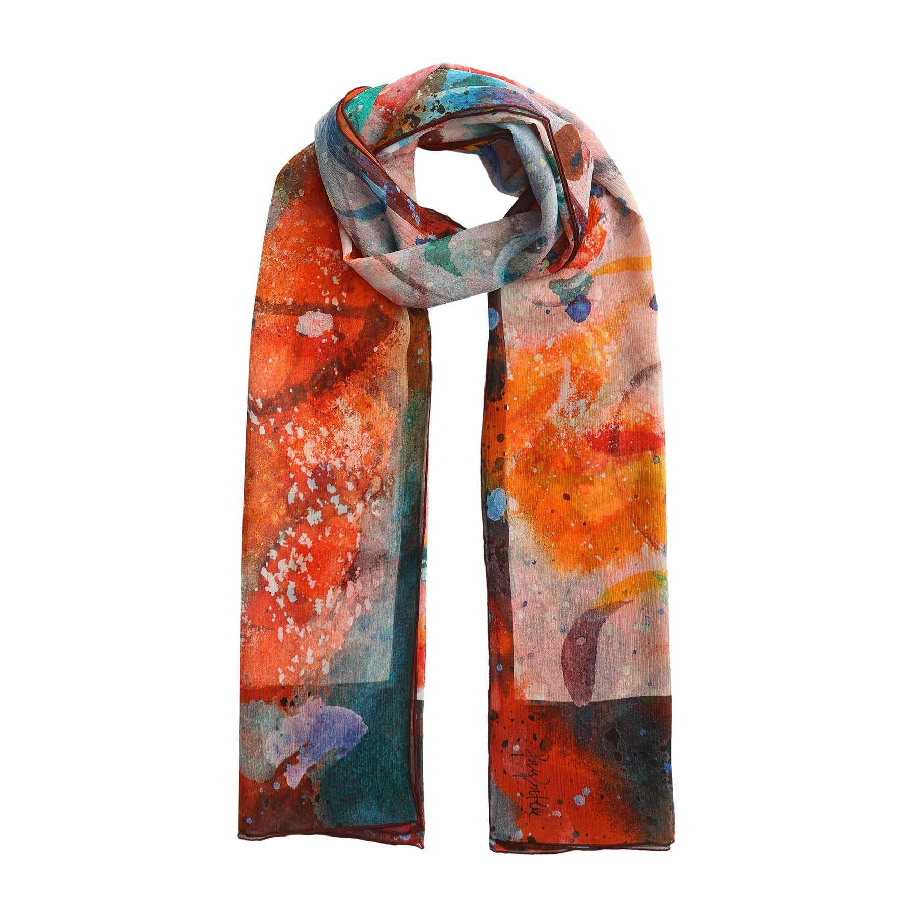 The Multicolor Silk Scarf Cangrejos is a long, lightweight muslin silk scarf featuring an abstract blend of orange, red, green, and blue splatter patterns—wearable art designed to drape neatly with both ends hanging down.