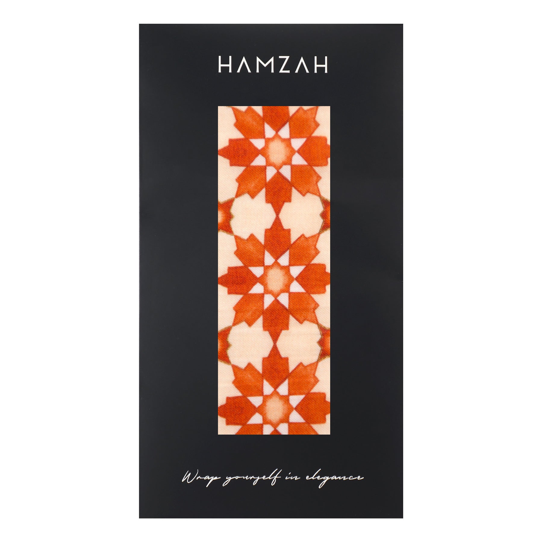 An Orange Scarf with Islamic Pattern Print featuring geometric stars is displayed vertically on black HAMZAH packaging labeled "Wrap yourself in elegance" at the bottom.