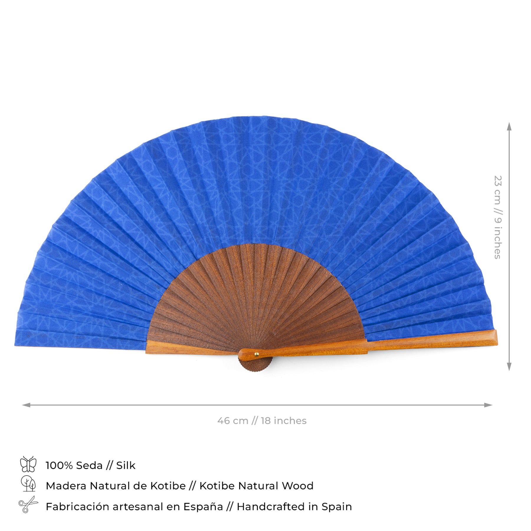 The Blue silk hand fan Dalila features a natural wood handle, measures 46 cm wide by 23 cm tall, and is handcrafted in Spain from premium materials with inspiration from Spanish tiles.