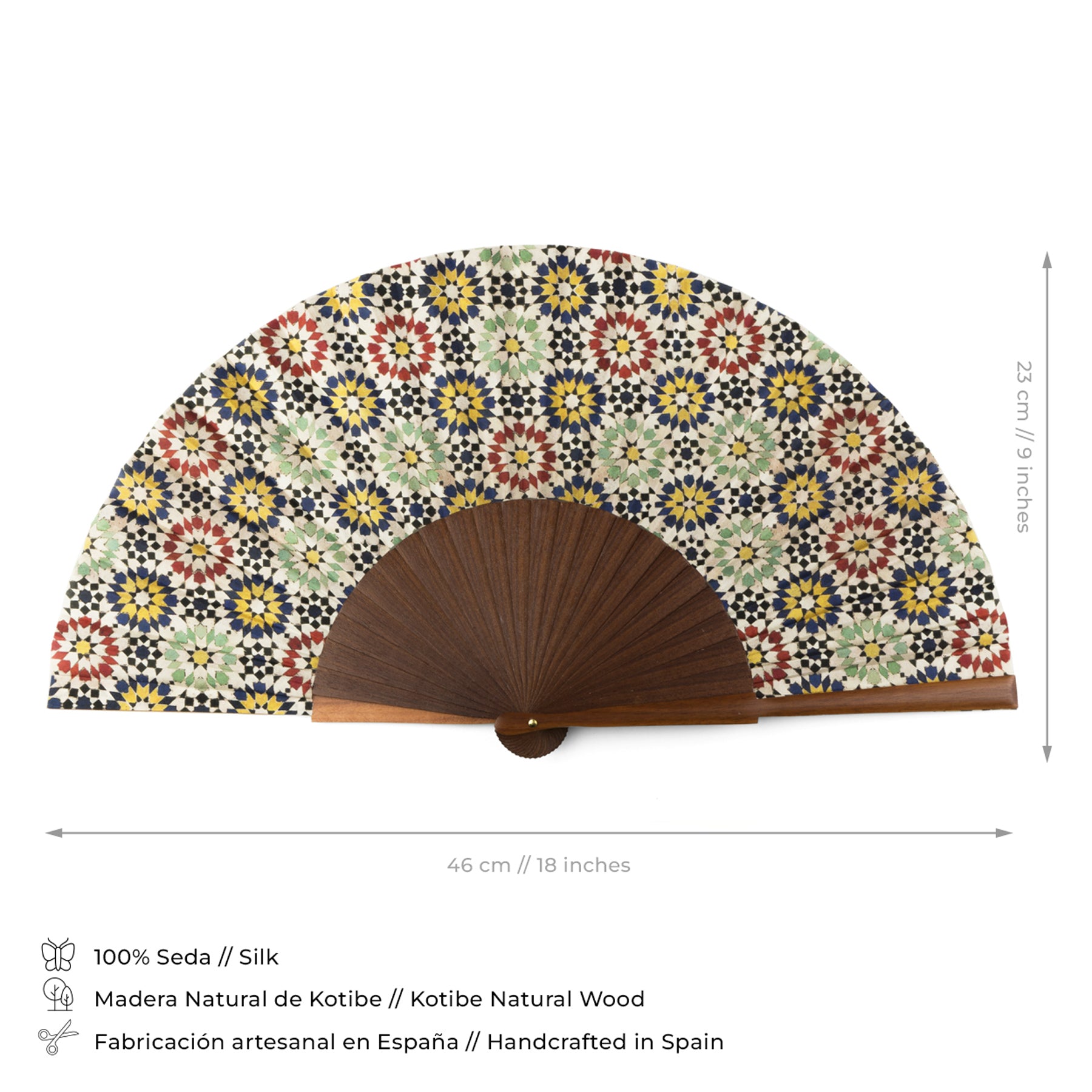 The Moroccan tiles inspired Silk & Wood hand fan Fezi features an intricate geometric floral pattern, measures 46 cm wide by 23 cm tall, and is handmade in Spain from Kotibe wood for elegant style and craftsmanship.