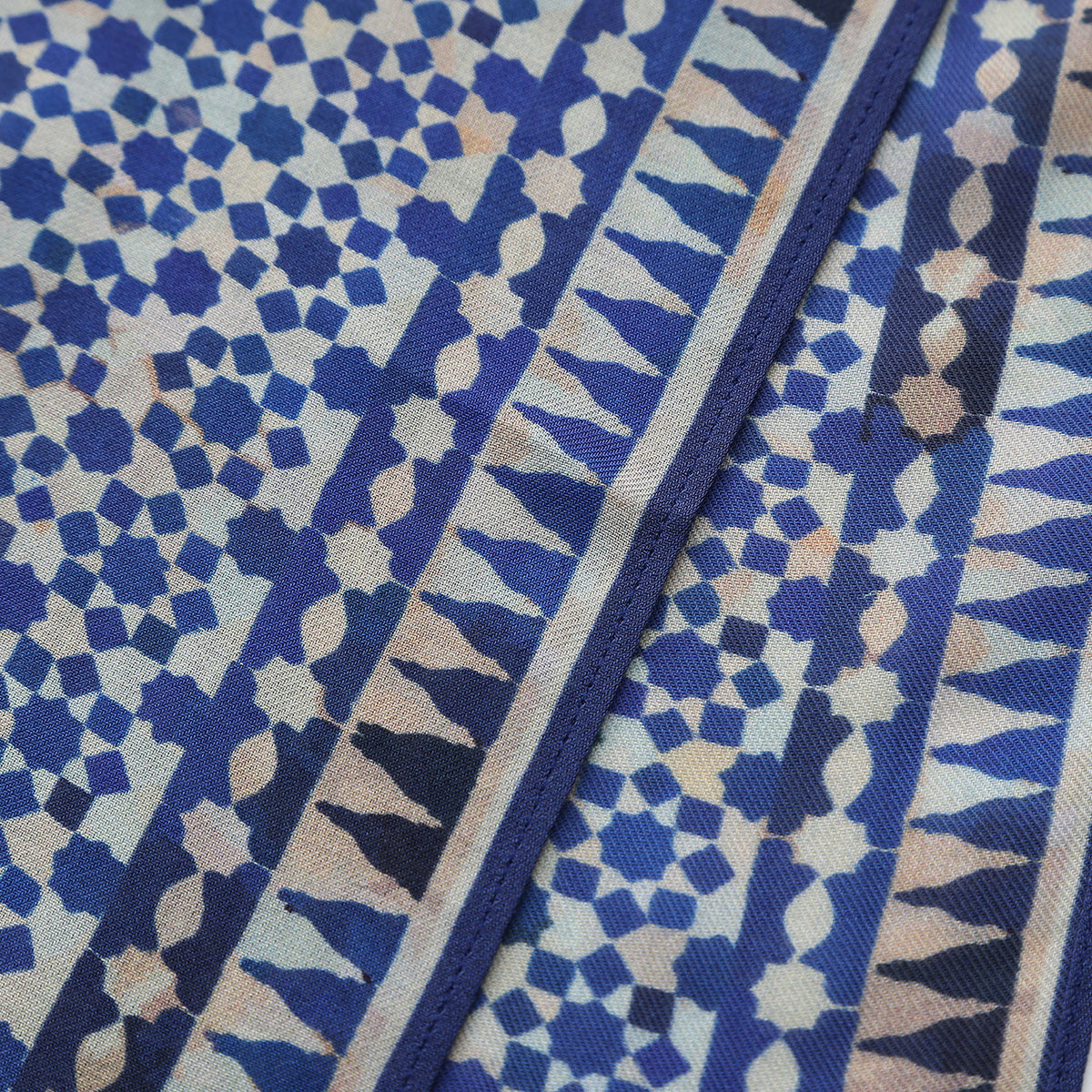 Corner of the Blue Modal Scarf Andalusian Tiles Almunia with the Hamzah woven label