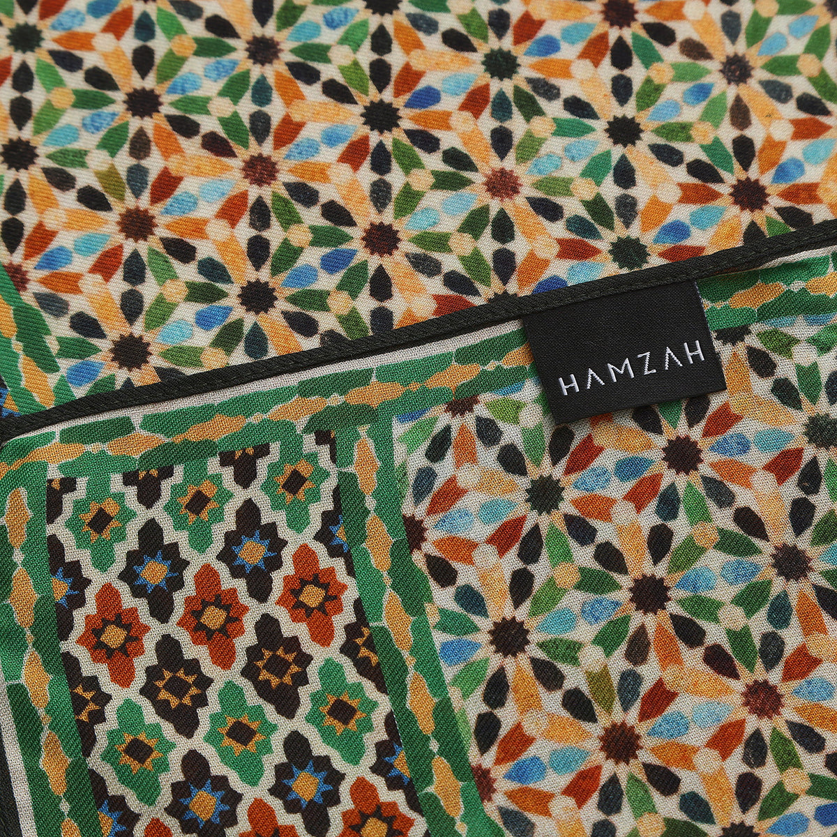 Corner of the Multicolor Modal Scarf Alhambra Stars Naima with the Hamzah woven label