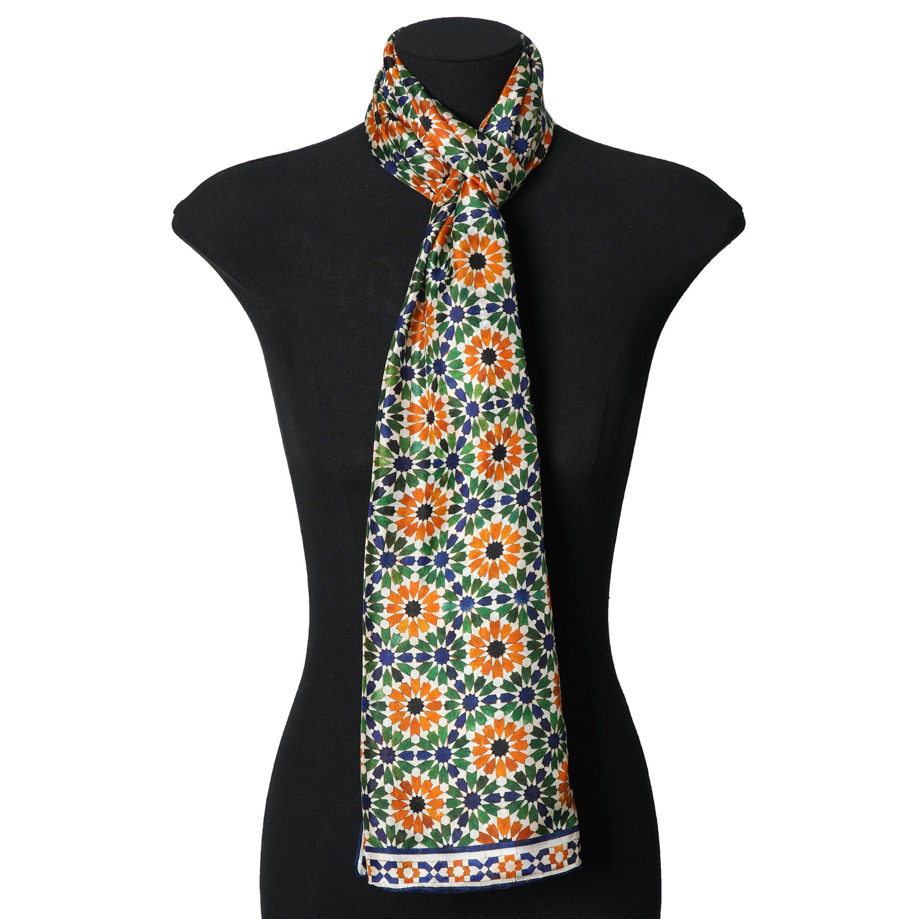Orange and Green Silk Scarf Alhambra Stars Nur knotted at the neck on a mannequin bust