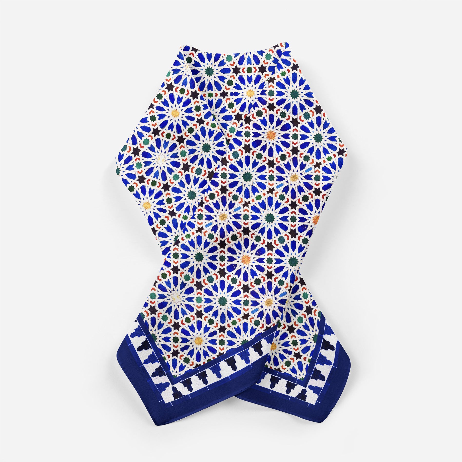 The Blue Square Scarf Zellige v2 features vibrant Islamic art with blue, white, green, and orange star shapes and a dark blue border of small motifs, beautifully crafted in Spain and displayed flat on a white background.