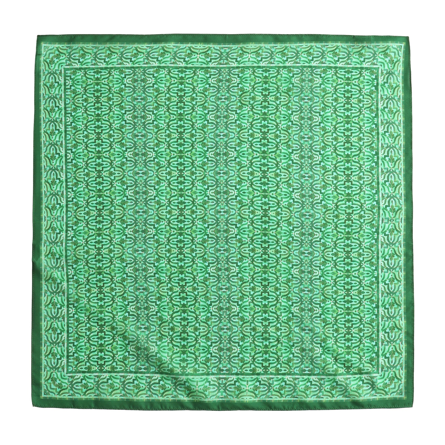 The Green Square Silk Scarf Fihri features an intricate, repeating geometric pattern inspired by Alhambra Palace and is finished with a darker green border.