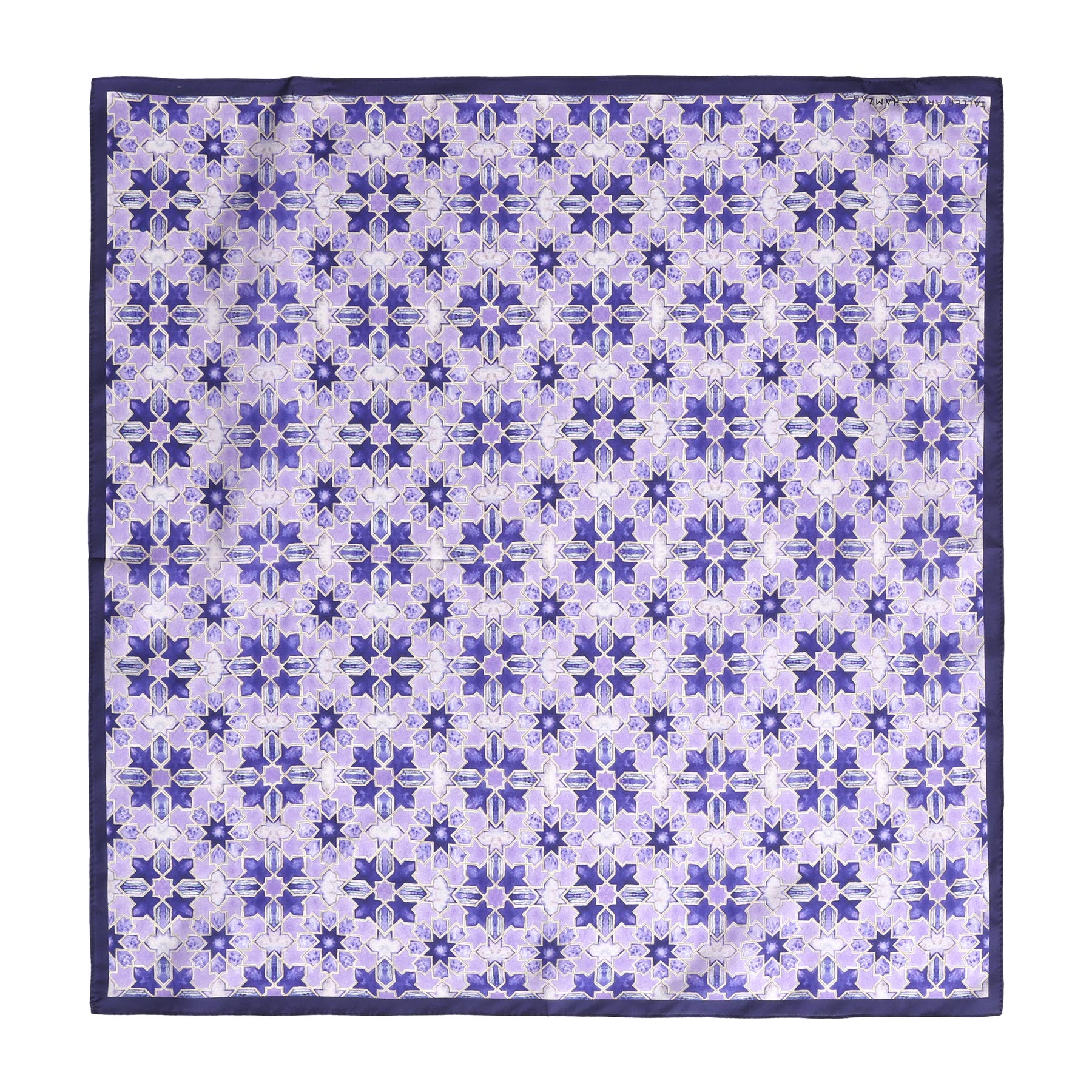 The Square Silk Scarf for Women Purple features a repeating geometric floral pattern in purple, lilac, and white, finished with a solid dark purple border.
