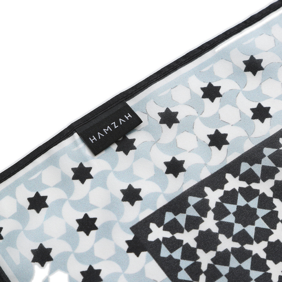 Border and hand-rolled edge detail of the Black and Grey Silk Square Scarf Zoraida