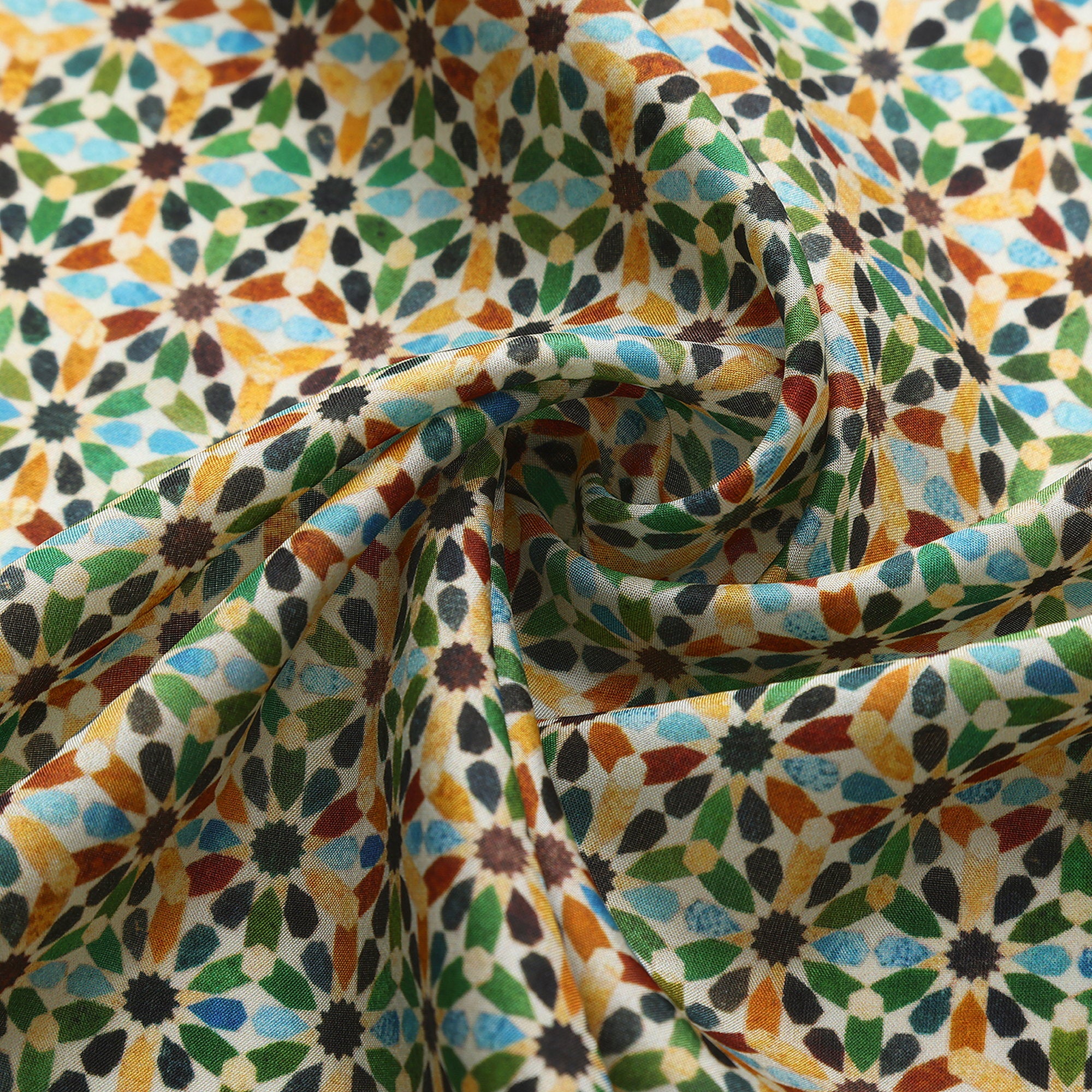 Close-up of the Naima silk print: the multicolour eight-pointed stars on cream