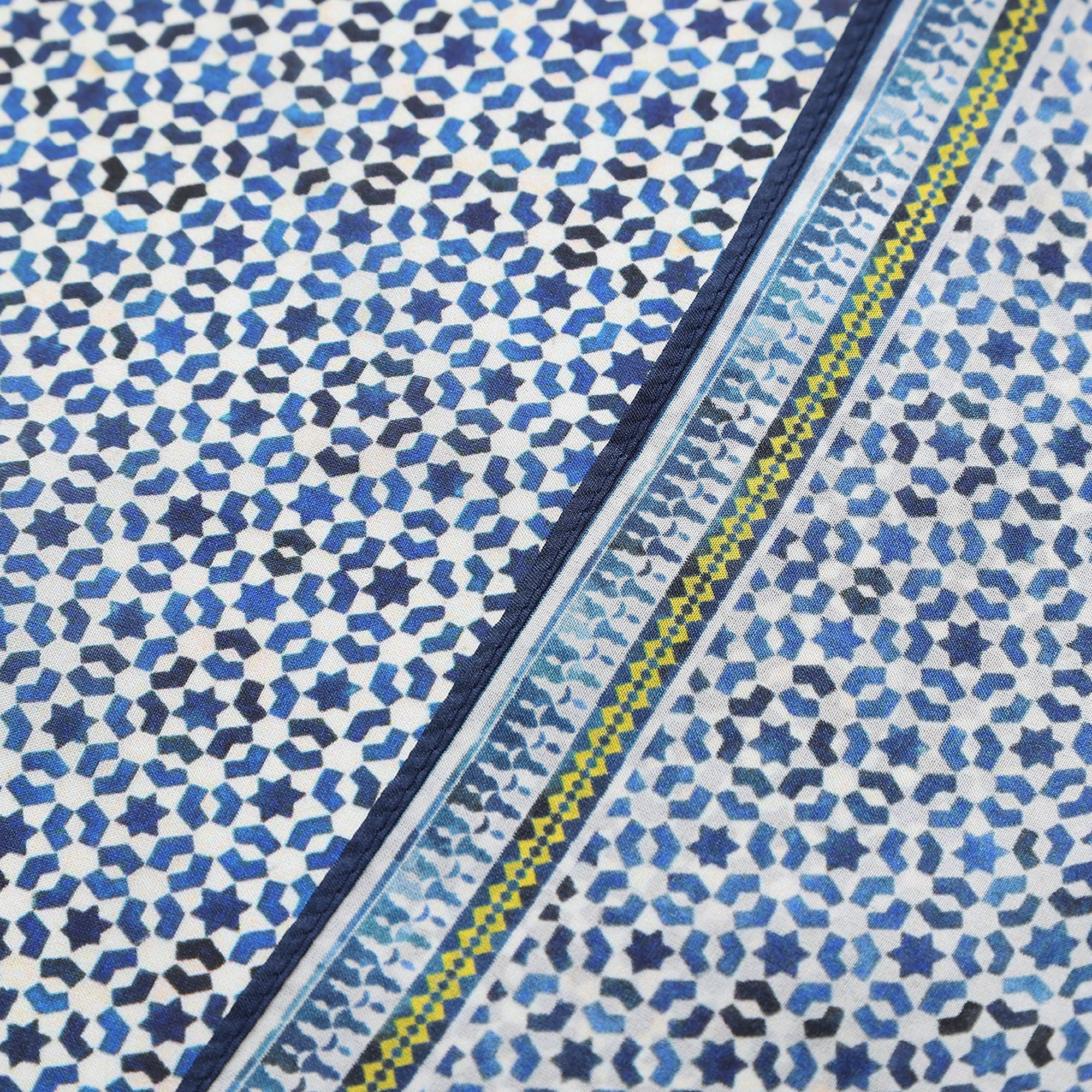 Border and hand-rolled edge detail of the Blue Silk Square Scarf Basma