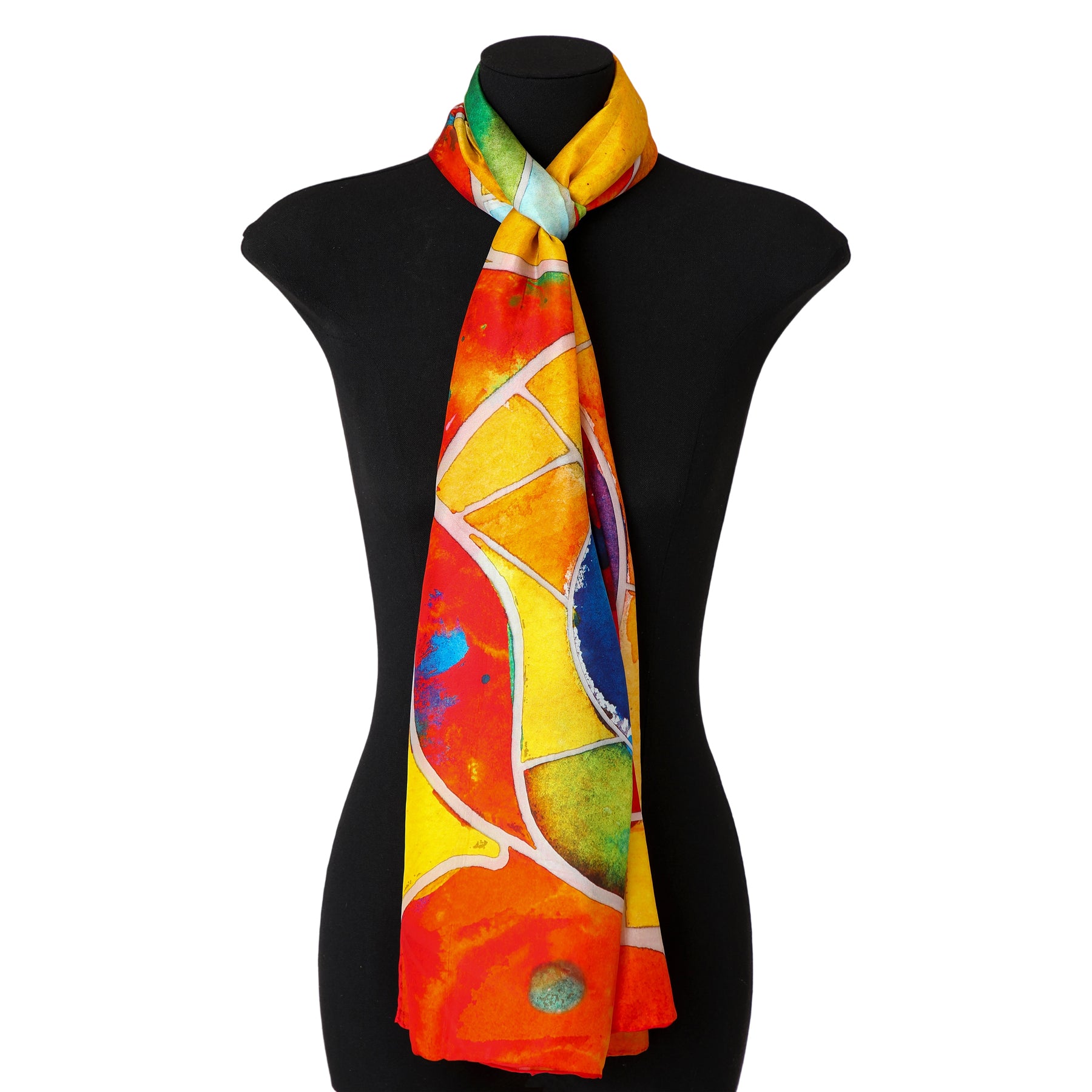 A mannequin showcases the Multicolor Silk Shawl for Women, featuring vibrant abstract patterns in red, yellow, orange, blue, and green—wearable artwork elegantly draped around its neck.