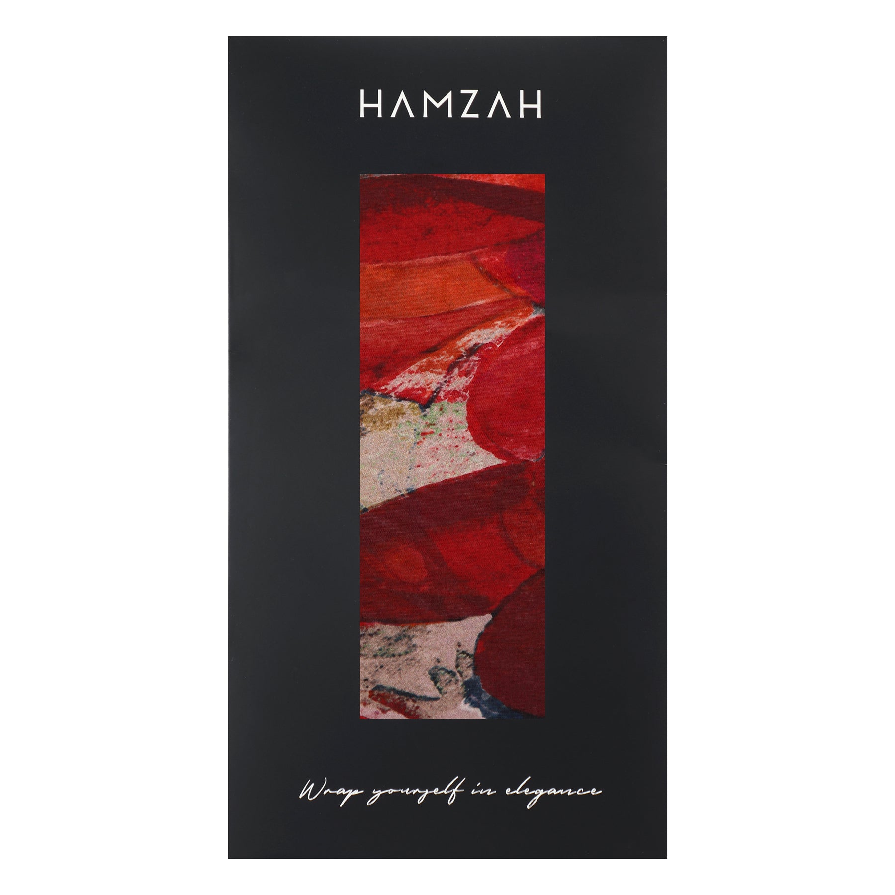 A black rectangular box features the word HAMZAH at the top, a vertical window showing a Navy Blue Silk Scarf Plumas al Viento with a feathery pattern, and “Wrap yourself in elegance” in cursive at the bottom.