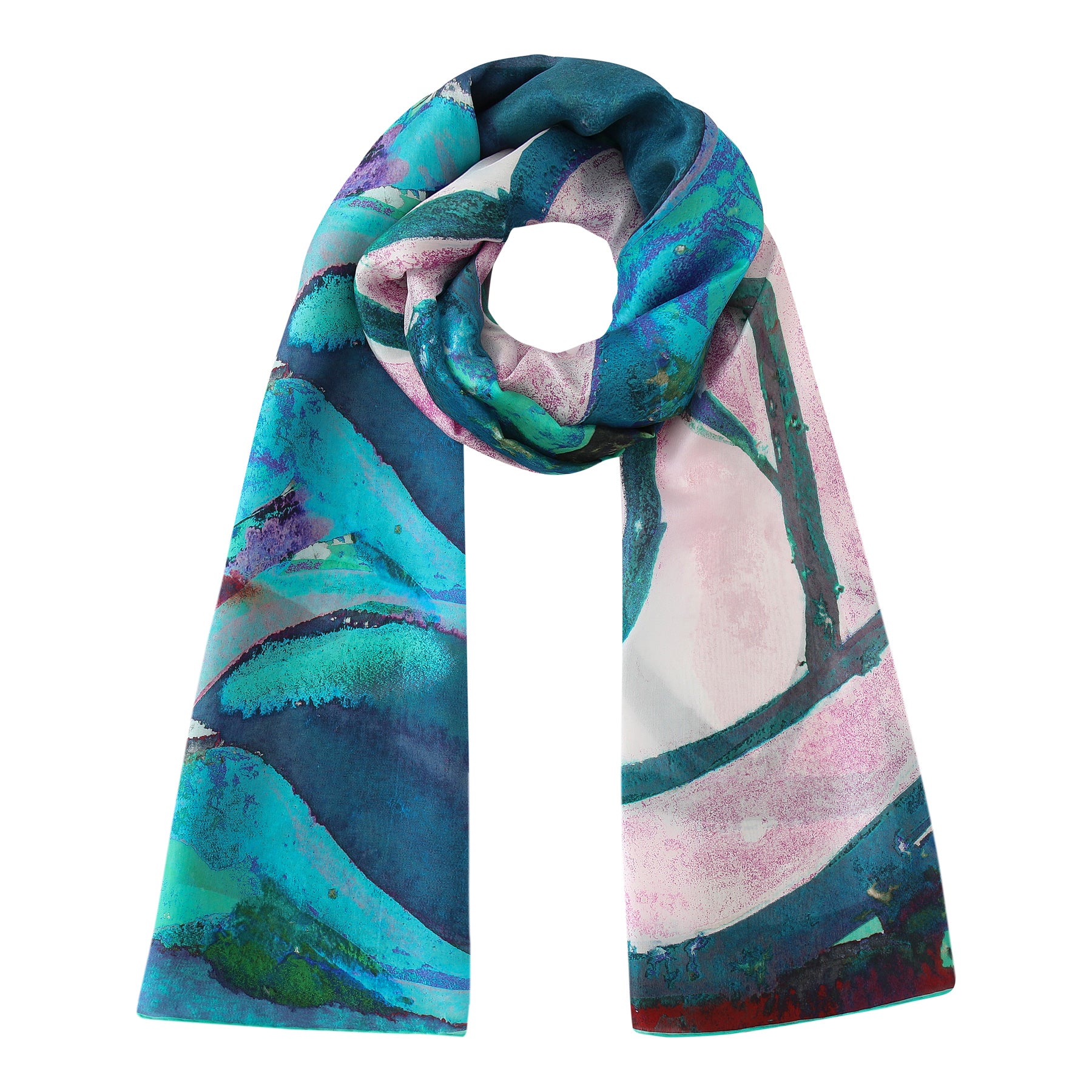 The Silk Shawl for Women Rosas Verdes features an abstract blue, teal, pink, and white watercolor-style pattern in a long, looping design—an eye-catching, Mediterranean-inspired accessory.
