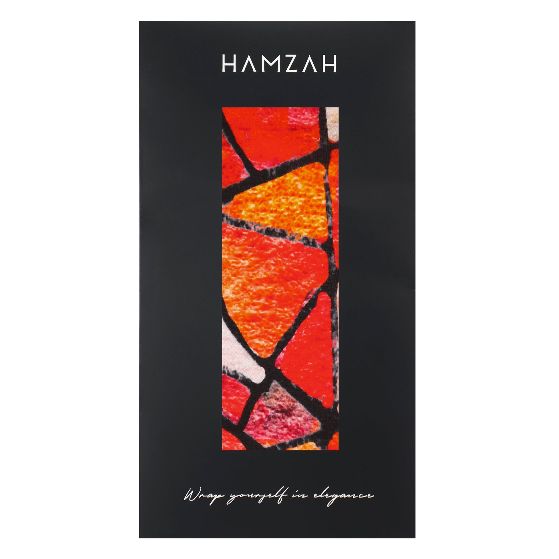 A black package displays the HAMZAH brand at the top, a vertical window showing the Artistic Silk Scarf Vitrales de Luz with a vibrant red, orange, and black geometric design inside, and "Wrap yourself in elegance" at the bottom.