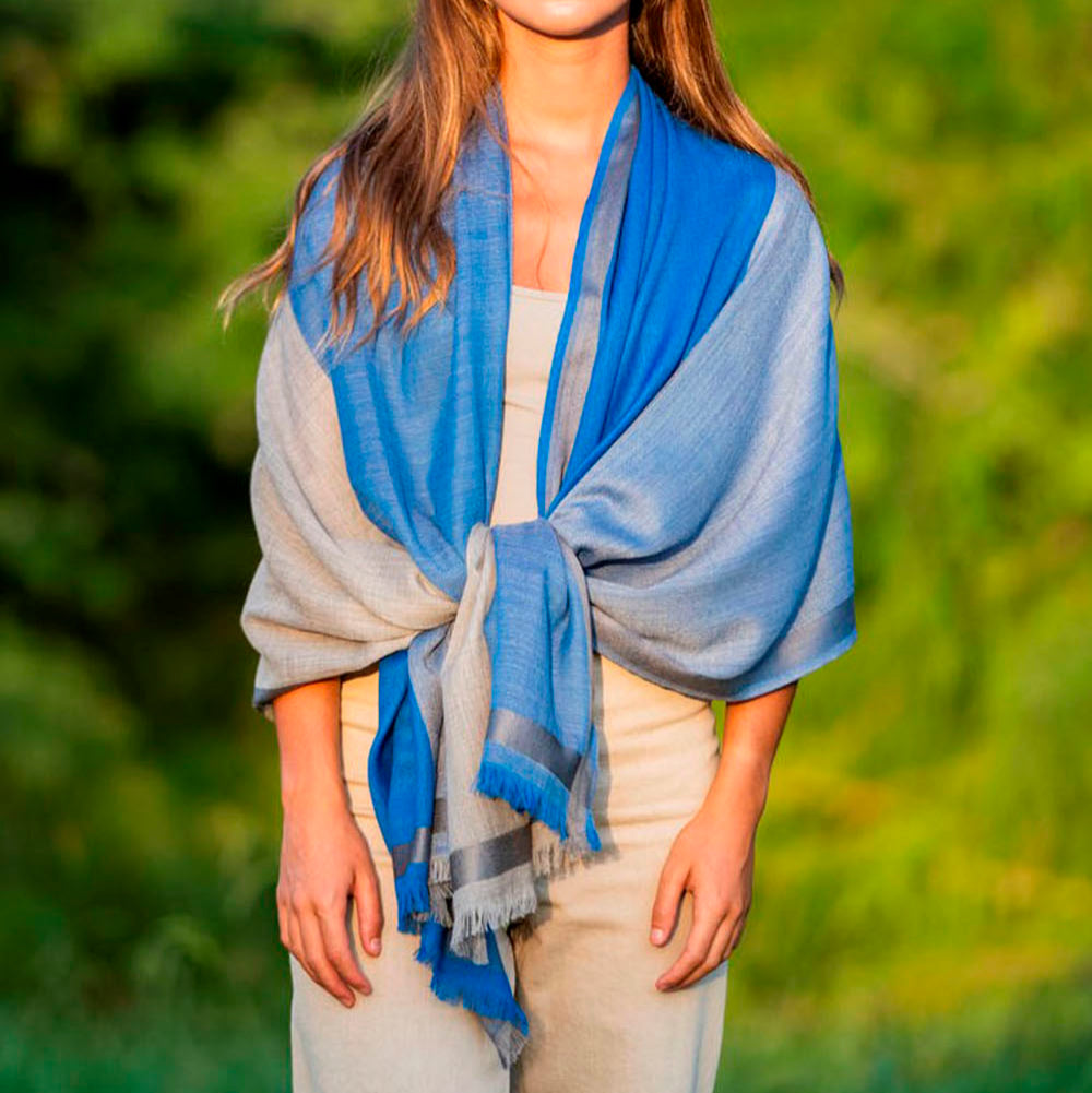 Woman featuring a blue silk and wool scarf over the shoulders