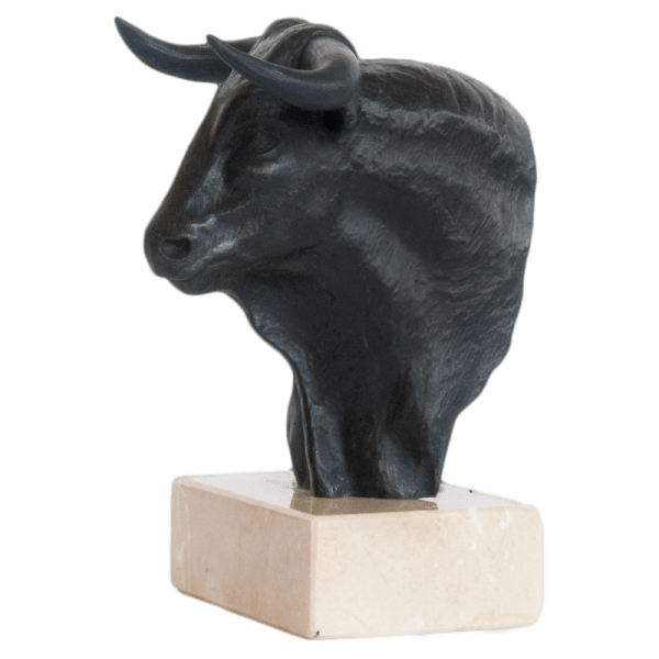 Bronze bull bust and head on top of a marble base