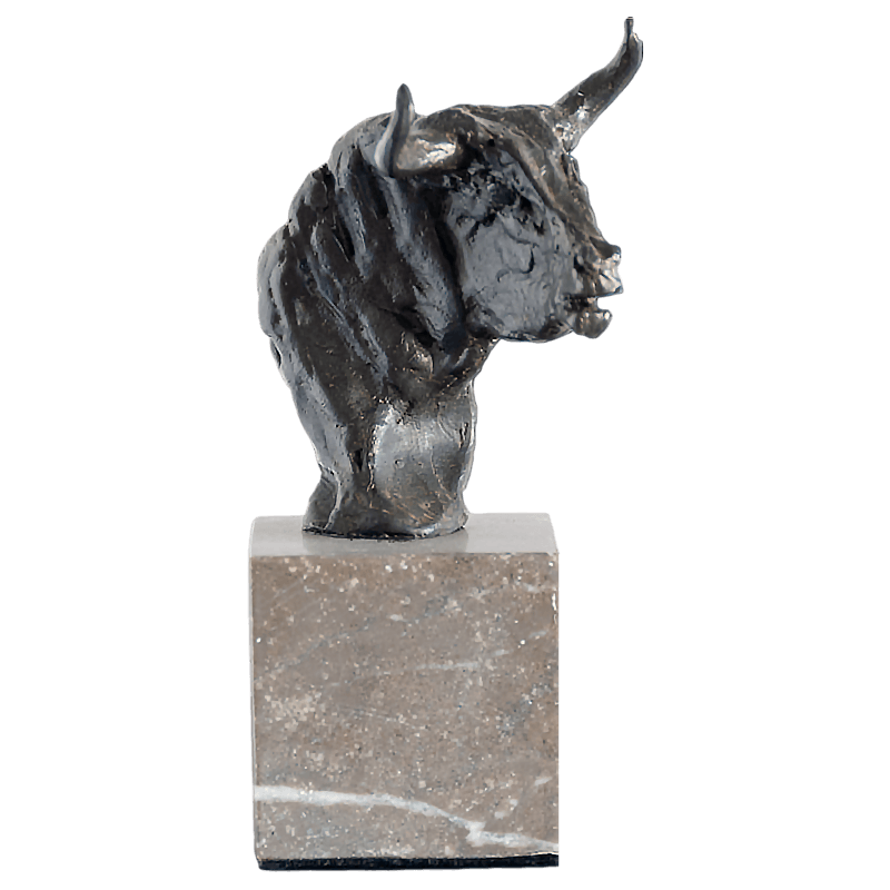 frontal view bulls head sculpture on top of a marble base