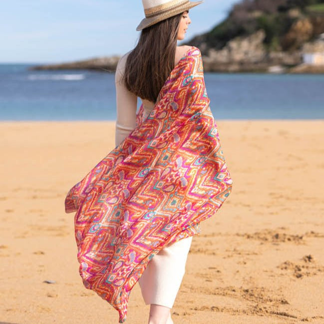 Woman with coral silk scarf with floral print large view