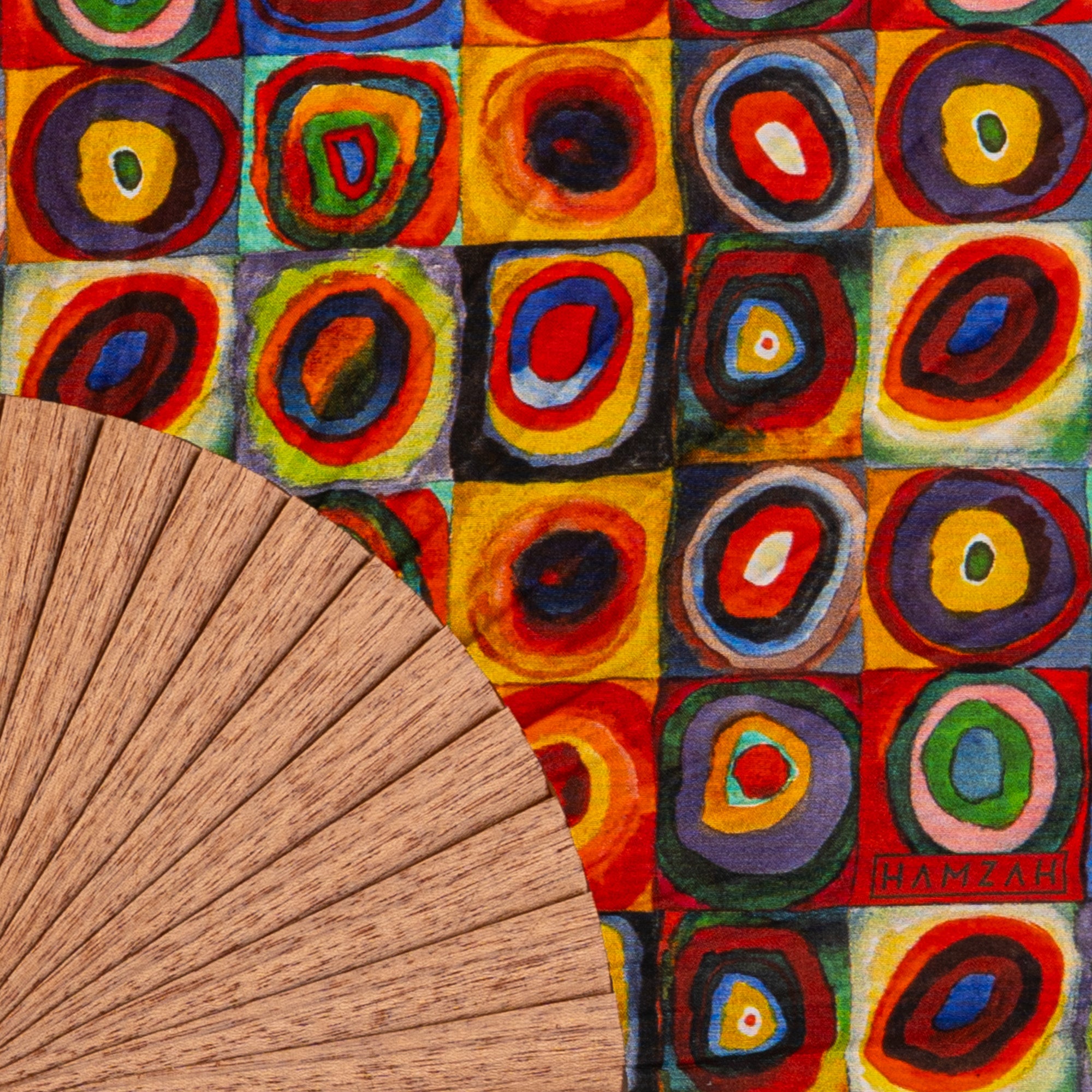 Close-up of the Kandinsky Print Hand Fan Lorelei showing the Kandinsky concentric circles colourful print in detail.