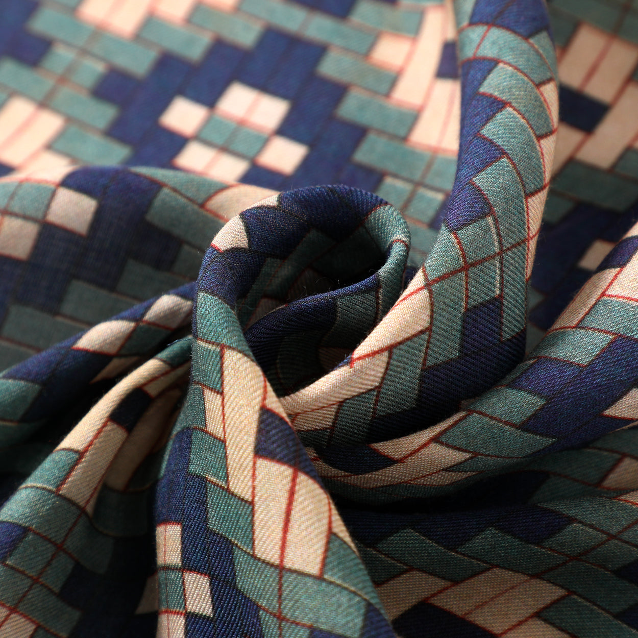 Detailed fabric texture of geometric Islamic print scarf.
