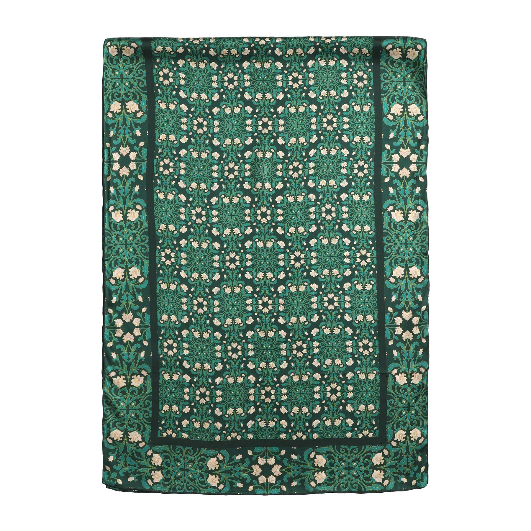A close-up of the Floral Green Silk Scarf with Delicate White Blooms shows ornate white flowers and leafy vines on dark green silk, elegantly folded to highlight its soft, textured art nouveau design.