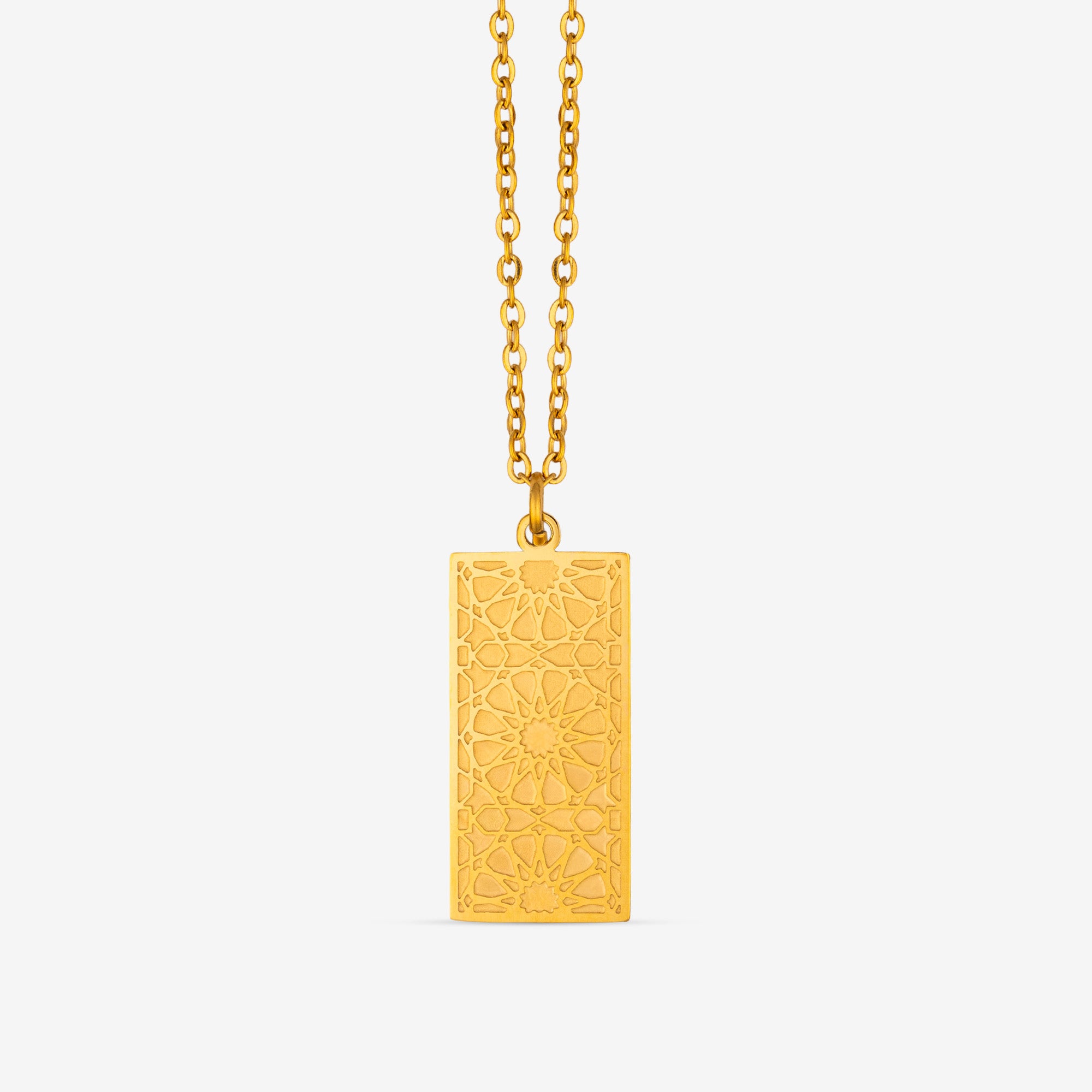 Colgante placa dorado grabado con lacería geométrica nazarí